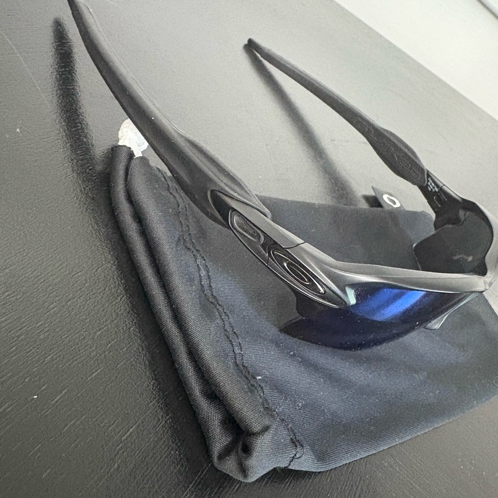 Oakley Black Sunglasses with blue lens
